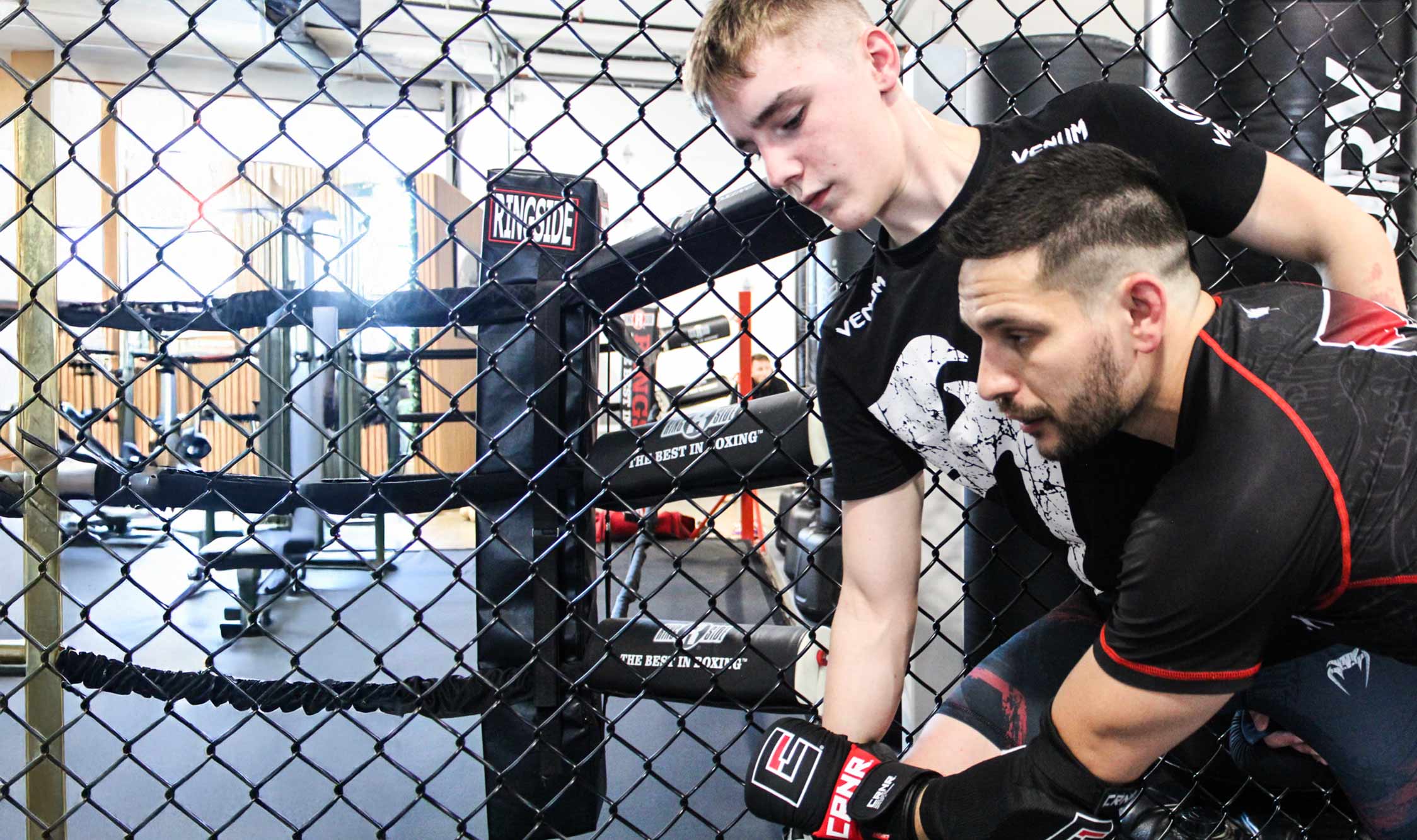 Marco grapples with another fighter during adult mma classes at Black Rock Martial Arts.