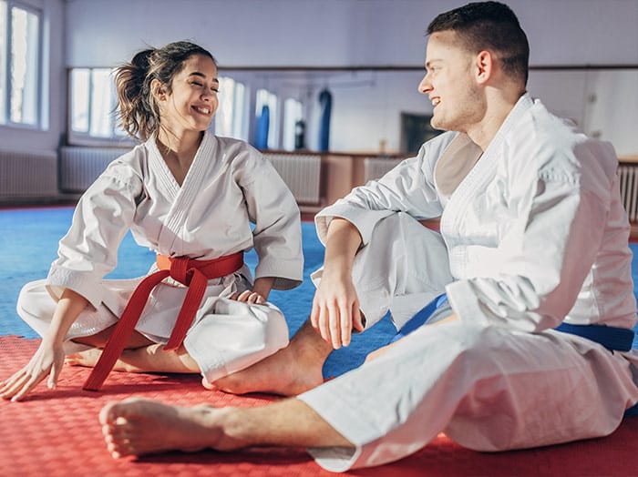 Marco of Black Rock Martial Arts teaches young students how to perform accurate taekwondo kicks.