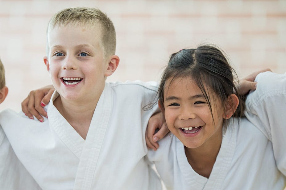 Marco of Black Rock Martial Arts teaches young students how to perform accurate taekwondo kicks.